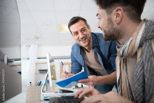 two happy architects working on the project