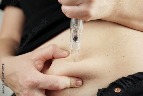 Woman injecting ozempic with pen injector photo