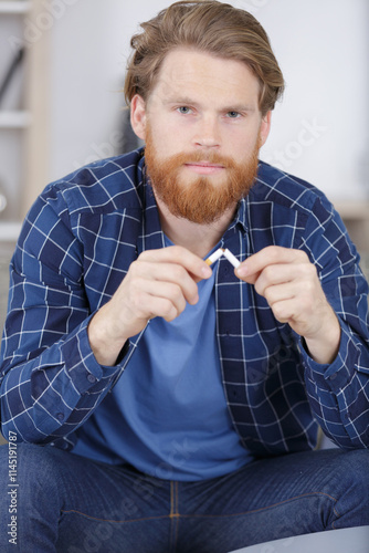 portrait of man trying to quit smoking