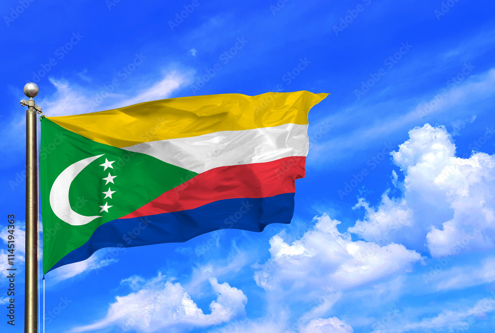 Comoros National Flag Waving Against a Bright Blue Sky