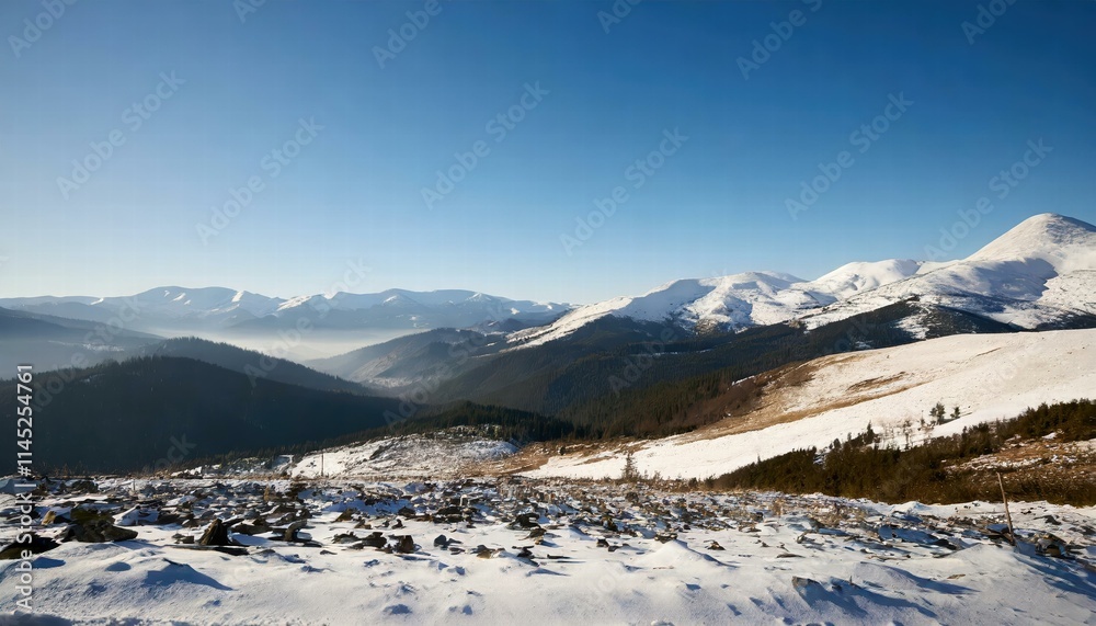 Fototapeta premium Breathtaking Wide Angle View of Majestic White Snowy Mountain Range Under a Clear Blue Sky During the Chilly Winter Season, Capturing Natures Serene Beauty and Tranquility