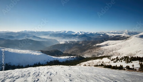 Breathtaking Wide Angle View of Majestic Snowy Mountain Range Under a Clear Blue Sky During Cold Winter A Stunning Winter Wonderland Landscape photo