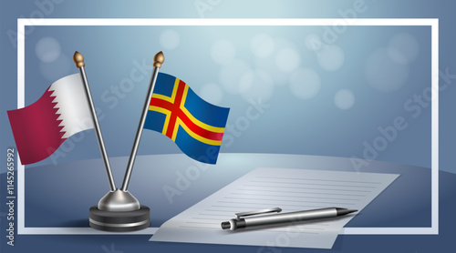 Qatar and Aland Islands National flags on small table with bokeh background, cooperative relationship.....