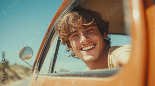 Happy young man smiling at the camera, sticking his head out of the car window while traveling on a sunny summer day. male person going on a holiday with a vehicle, fun adventure and freedom trip.