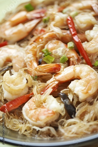 Delicious shrimp stir-fry with glass noodles and red chili garnished with scallions in a serene kitchen setting photo