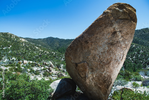 A giant granite boulder stands above a desert valley on Mount Lemmon, Tucson, Arizona