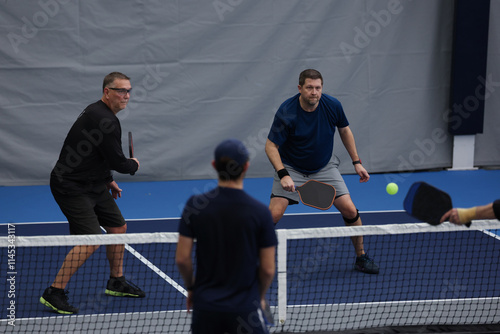 Pickleball doubles played indoors