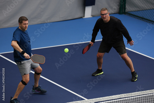 Pickleball doubles played indoors