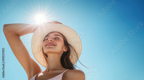 Relaxed Summer Moment: Woman with Straw Hat Under Vibrant Sunshine