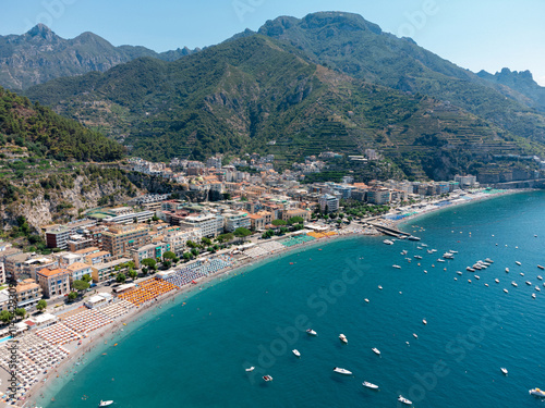 Aerial View of Maiori Beach on the Amalfi Coast - Vibrant Italian Summer Scene with Sunbathers, Boats, and Crystal-Clear Mediterranean Waters in a Stunning Coastal Destination