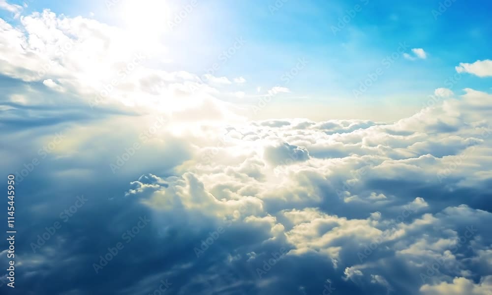 Aerial view of soft clouds illuminated by sunlight against a blue sky. Aerial view of soft clouds illuminated by sunlight against a blue sky.