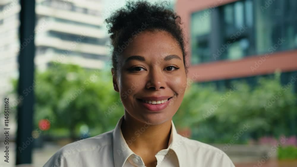 Happy African American woman looking at camera smiling toothy dental smile positive female girl businesswoman outdoor joyful portrait ethnic face manager employer entrepreneur expression business city Happy African American woman looking at camera smiling toothy dental smile positive female girl businesswoman outdoor joyful portrait ethnic face manager employer entrepreneur expression business city