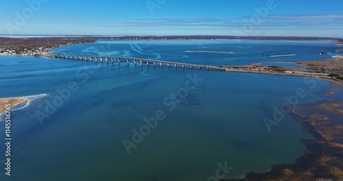 Southampton, NY, USA - 11-20-2024:  Late morning aerial, drone, video of Panquogue Beach on a sunny fall day.  30 FPS