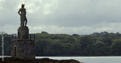 wide shot of a statue of Lord Nelson looking over the Menai Strait at low tide photo