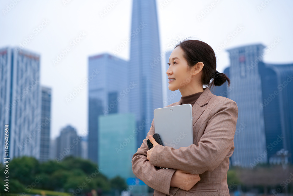 Confident Businesswoman Overlooking Urban Cityscape with Modern Architecture Confident Businesswoman Overlooking Urban Cityscape with Modern Architecture