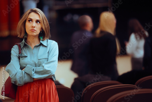 Introvert Woman Attending a Public Gathering Event. Unhappy bored lady not interacting with a group of people 
