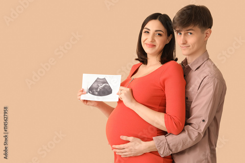 Young pregnant couple with ...