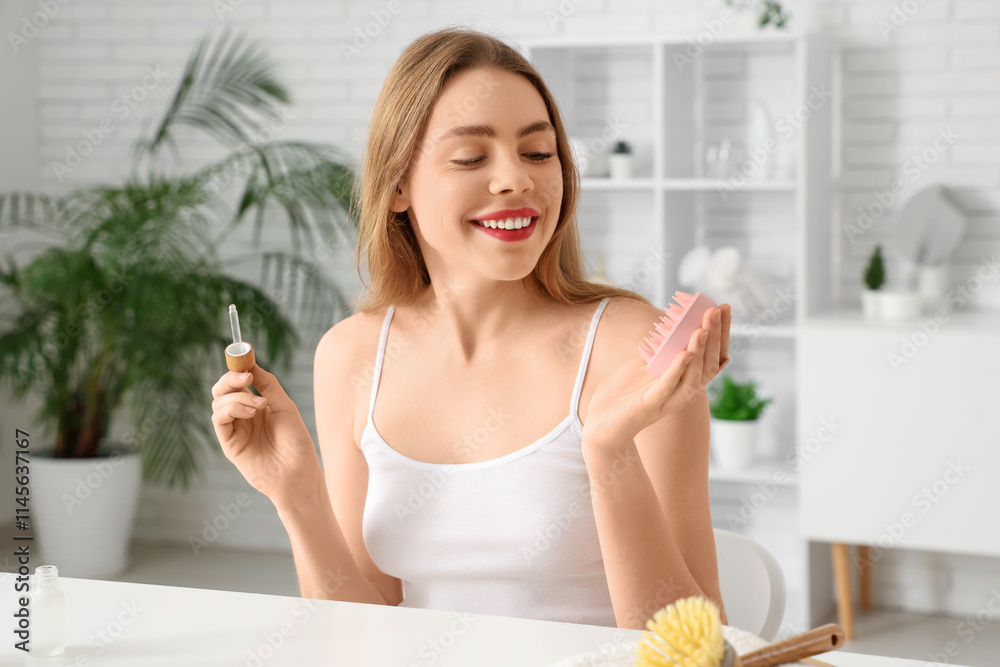 Young woman with serum and hair scalp massager at home Young woman with serum and hair scalp massager at home