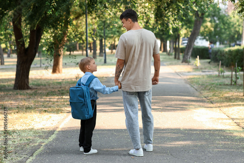 Father walking his little s...