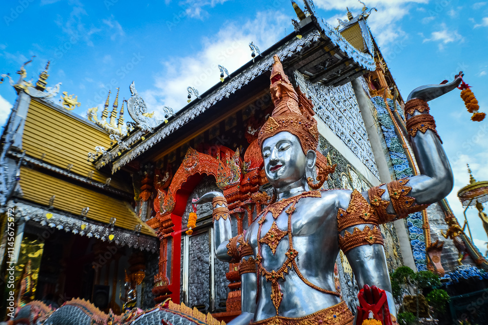 Fototapeta premium Angel statue and Church, Lanna Architecture at Watsridonmoon, smbols of Buddhism, South East Asia at Chiangmai Northern Thailand