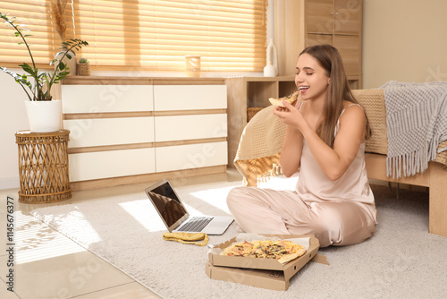 Young woman in pajamas with...