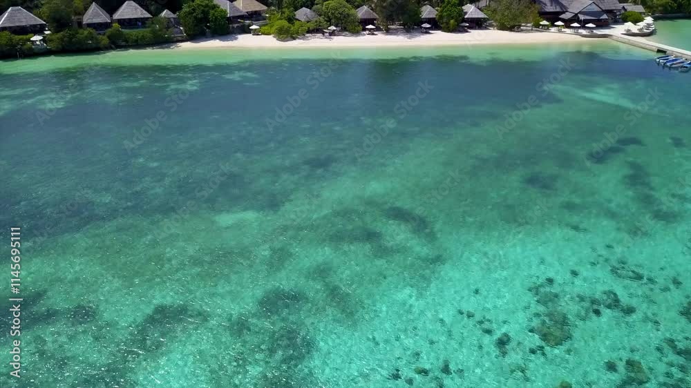 Lagoon and bungalows at Wakatobi resort in Indonesia. Lagoon and bungalows at Wakatobi resort in Indonesia.