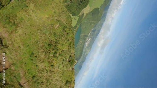 Fpv vertical shot over great lake and hills in the summer photo