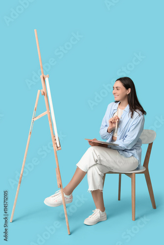 Smiling young woman artist ...