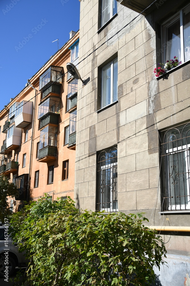 Architecture of old Soviet Union houses in Stalin's Empire style. Exterior of the facade of a vintage residential building in Russia Architecture of old Soviet Union houses in Stalin's Empire style. Exterior of the facade of a vintage residential building in Russia