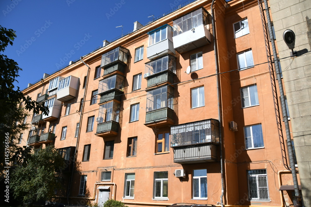 Fototapeta premium Architecture of old Soviet Union houses in Stalin's Empire style. Exterior of the facade of a vintage residential building in Russia