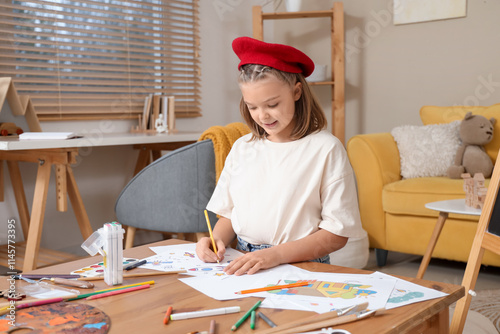 Cute artist drawing on tabl...