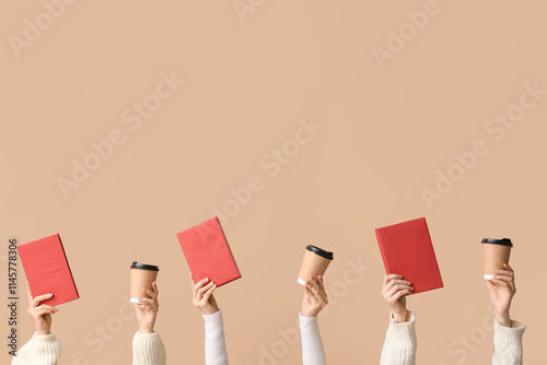 Multiple hands holding red ...