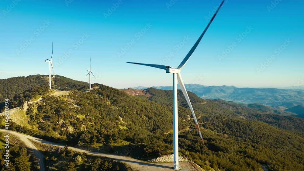 Wind turbines in the wind energy farm in mountain. Energy transition with wind power farm with carbon neutral Wind turbines in the wind energy farm in mountain. Energy transition with wind power farm with carbon neutral
