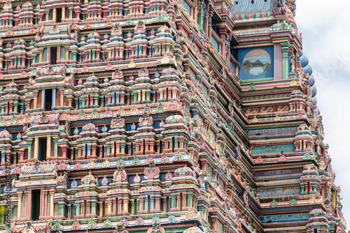 Close up detail of the intricate designs on the gopuram tower of the ancient Sriranganathaswamy temple in Srirangam photo