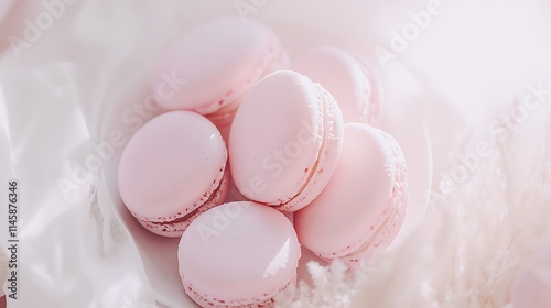 Delicate Pink Macarons on White Fabric Background