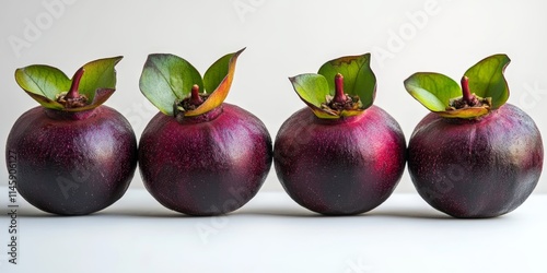 Mangosteen fruit displayed in isolation on a white background, highlighting the unique characteristics and vibrant coloration of the mangosteen. Ideal for showcasing the mangosteen s appeal.