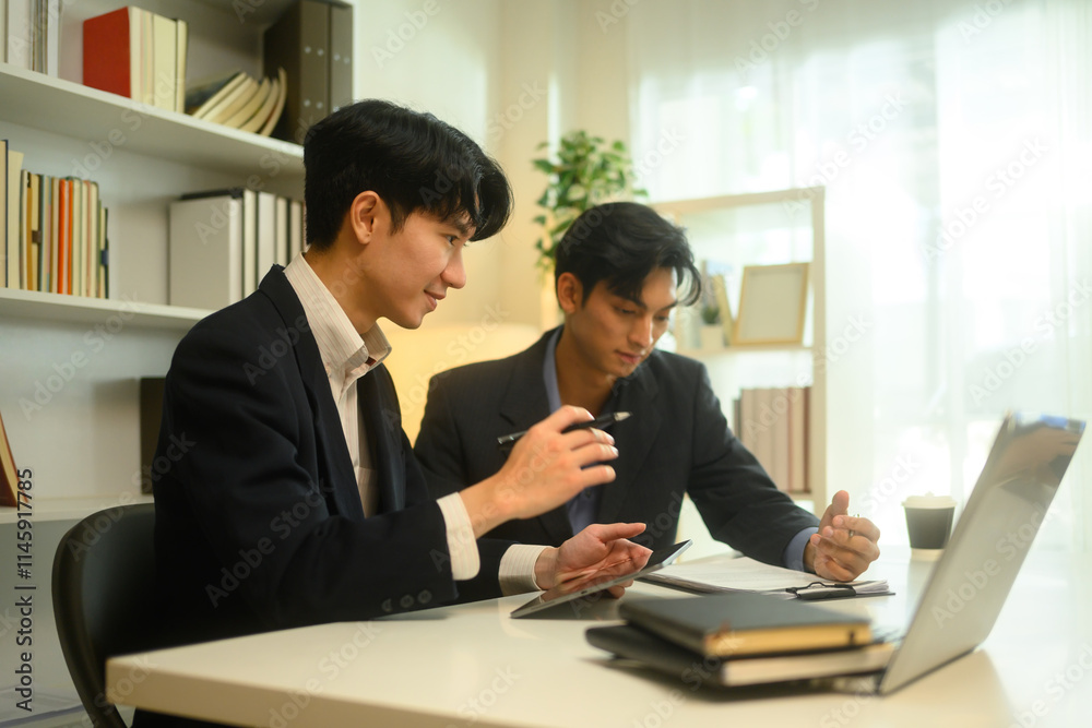 Business advisor offering and discussing the details of the agreement with his client Business advisor offering and discussing the details of the agreement with his client
