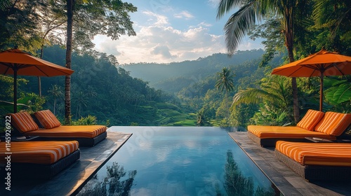 Fototapeta Naklejka Na Ścianę i Meble -  Infinity pool overlooking lush green rice terraces and mountains at sunrise.