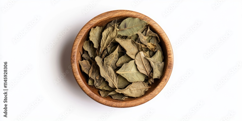 Dried senna leaves arranged in a wooden bowl against a clean white background. This top down view showcases the dried senna leaves in a natural setting, highlighting their unique texture. Dried senna leaves arranged in a wooden bowl against a clean white background. This top down view showcases the dried senna leaves in a natural setting, highlighting their unique texture.