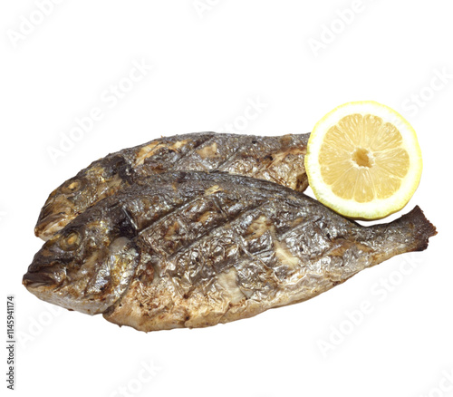 Two grilled dorado fish with lemon slice on transparent background