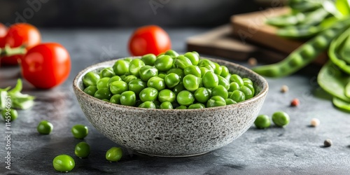 Fresh uncooked mangetout peas are vibrant and delicious. Enjoy the crisp texture of fresh mangetout peas in various dishes to elevate your meals with their light and refreshing flavor. photo