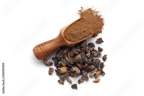 A wooden scoop filled with organic dried Gooseberry (Phyllanthus emblica) or Amla powder, placed beside a heap of gooseberry fruits, isolated on a white background. photo