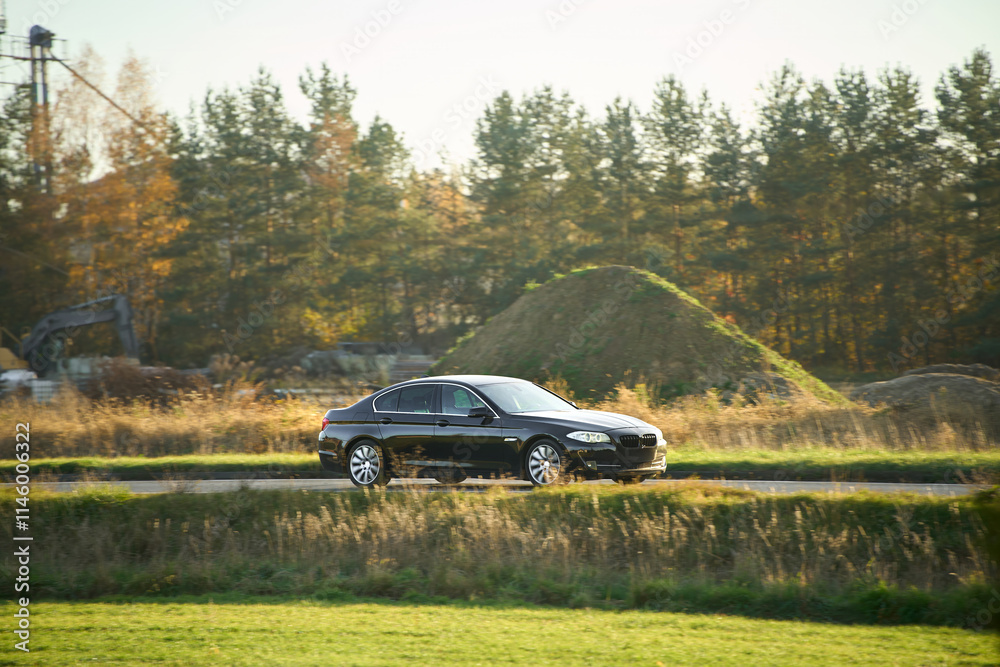 Fototapeta premium Stylish car in rural outdoor setting