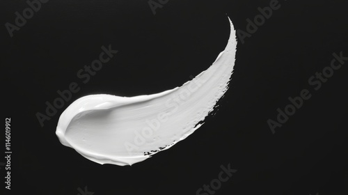 White lotion brush on black background