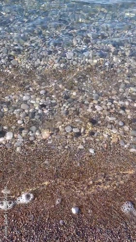 Sea Water Calm Waves Blows On Shore. Close up