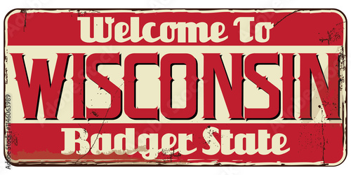 Welcome to Wisconsin message on rusty sign