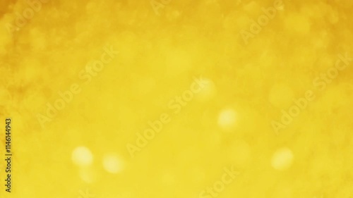 Abstract festive yellow golden bokeh background.
Circles are slowly flying, seamless loop 4K animation.