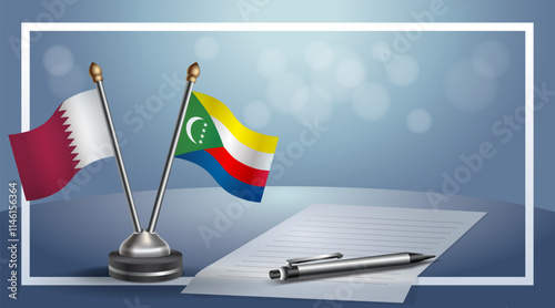 Qatar and Comoros National flags on small table with bokeh background, cooperative relationship
