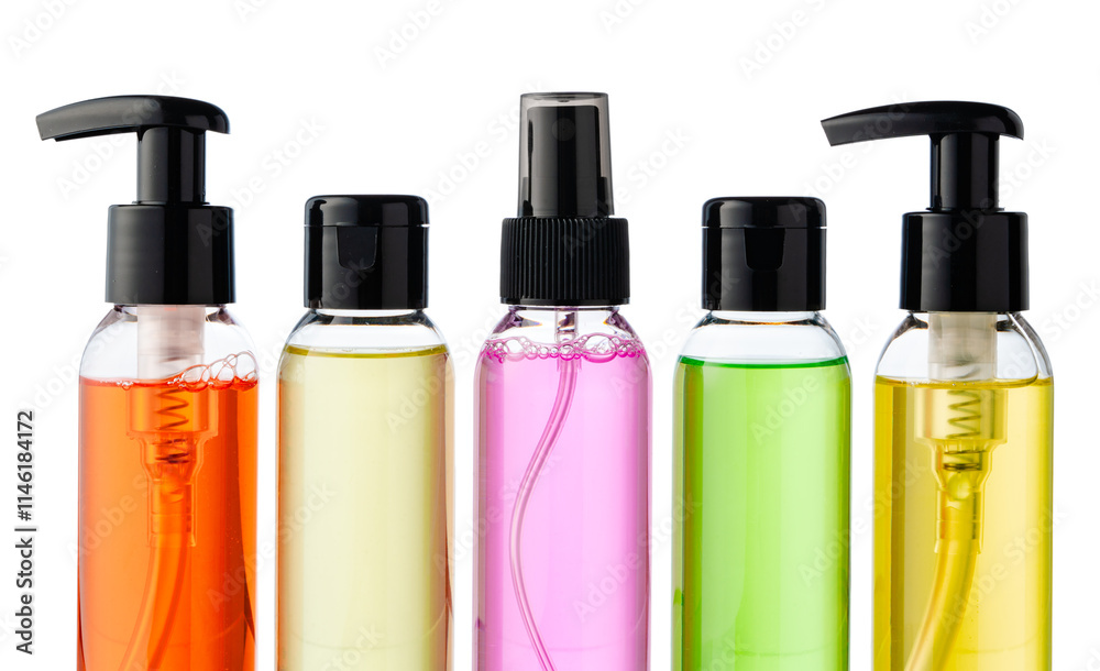 Various bottles with colored liquids and pumps arranged on white background Various bottles with colored liquids and pumps arranged on white background