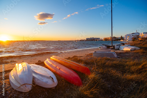 Formentera, playa de la Savina al atardecer con barcas